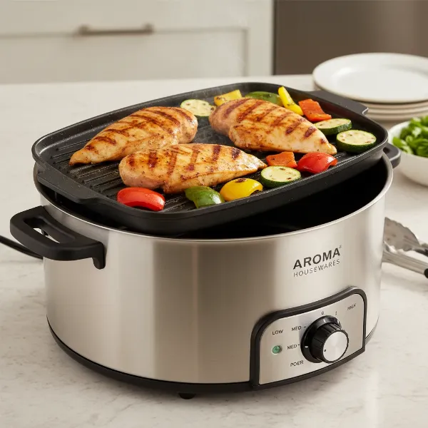 Aroma 3-in-1 Super Pot grilling chicken and vegetables, showing grill marks and minimizing splatter.